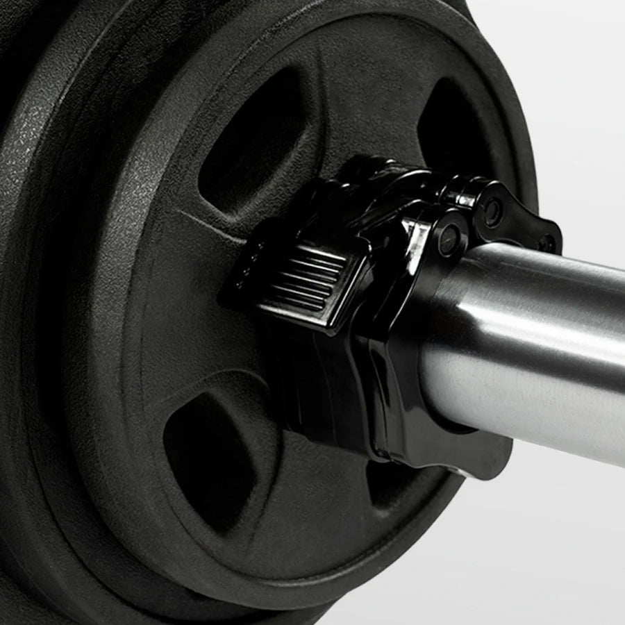 Close-up of a barbell with weight plates on a white background