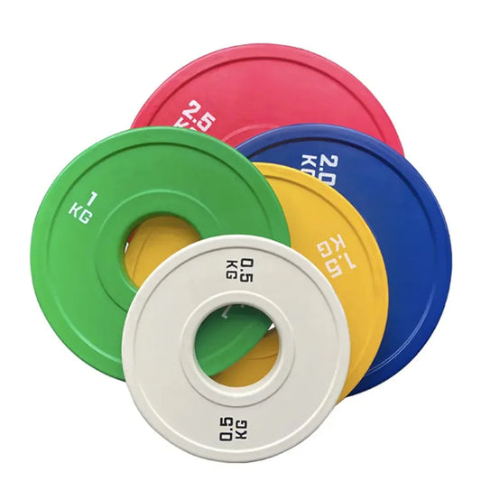 Colorful weight plates on a white background