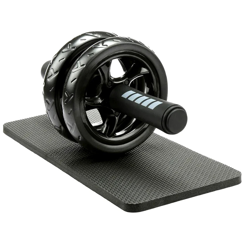 Black ab roller on a black mat with a white background