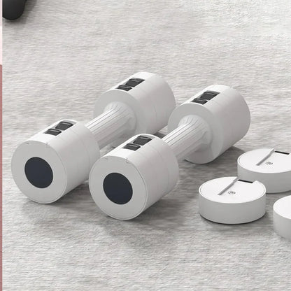 Set of white dumbbells with black circular ends on a gray surface