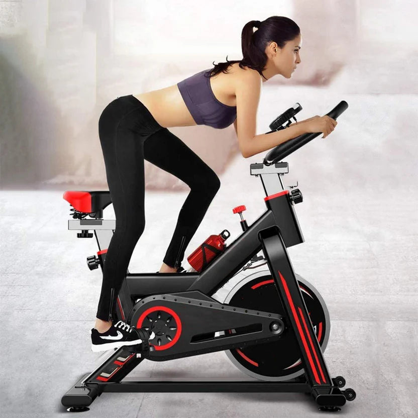 Woman exercising on a stationary bike in a home setting