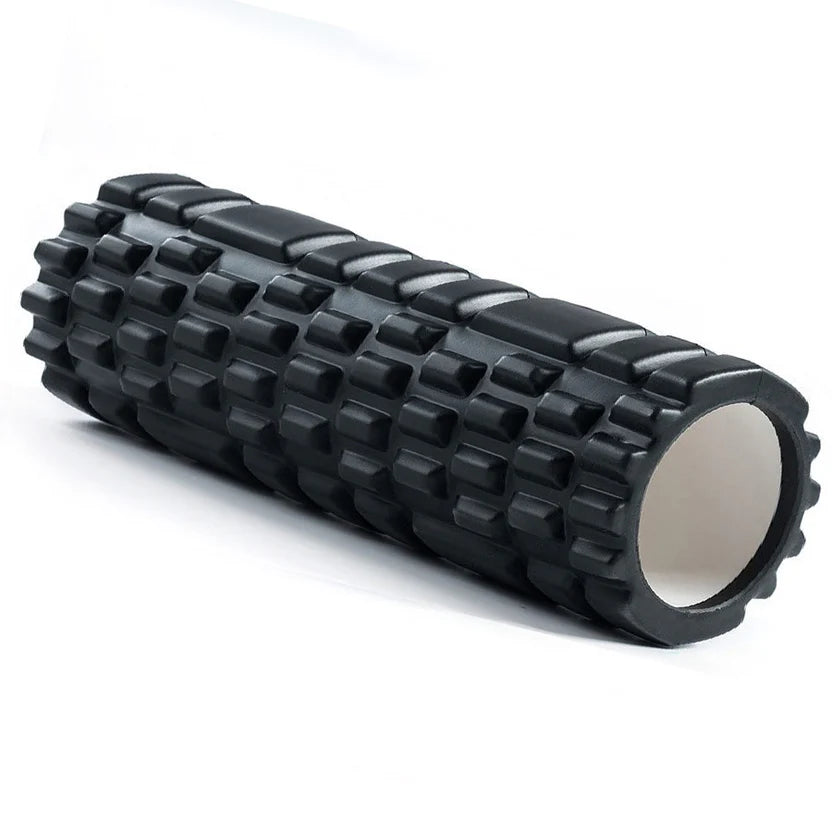 Black textured foam roller on a white background