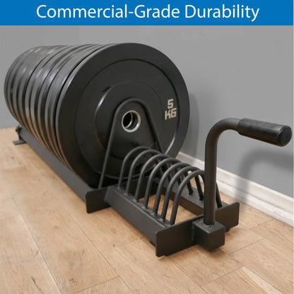 Weight plate rack with weight plates on a wooden floor against a gray wall.
