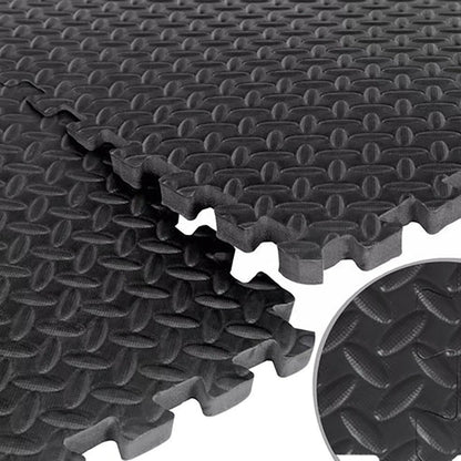 Stack of black interlocking foam mats with textured surface