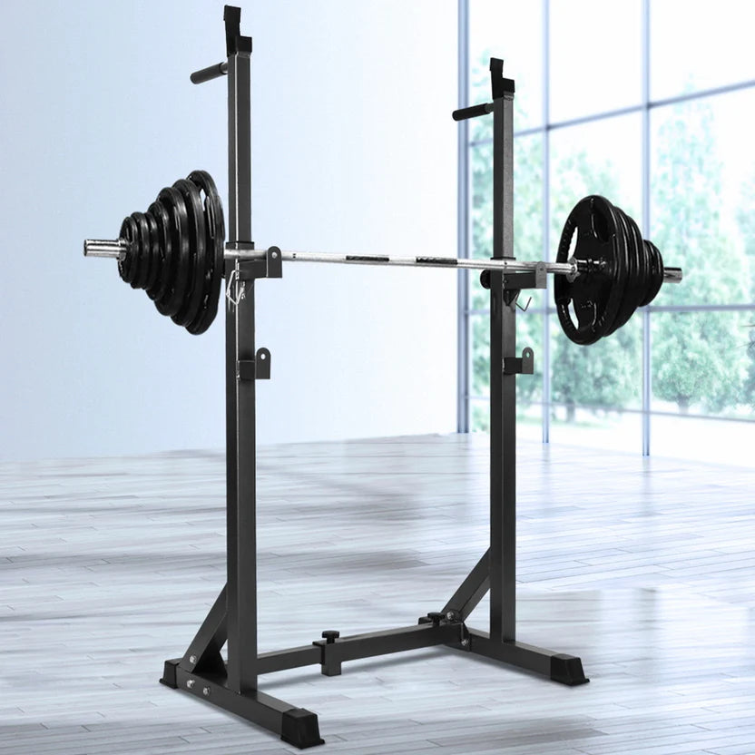 Heavy-Duty Adjustable Half Squat Rack with Dip Station and Spotters with weight plates.