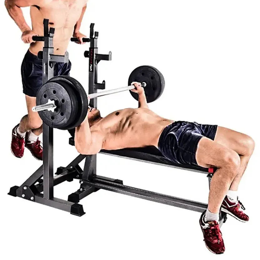 Heavy-Duty Adjustable Half Squat Rack with Dip Station and Spotters with weight plates.