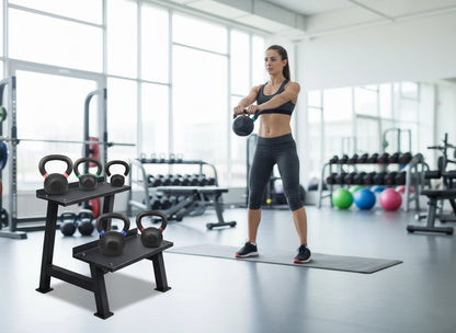 Woman exercising with kettlebells in a gym setting