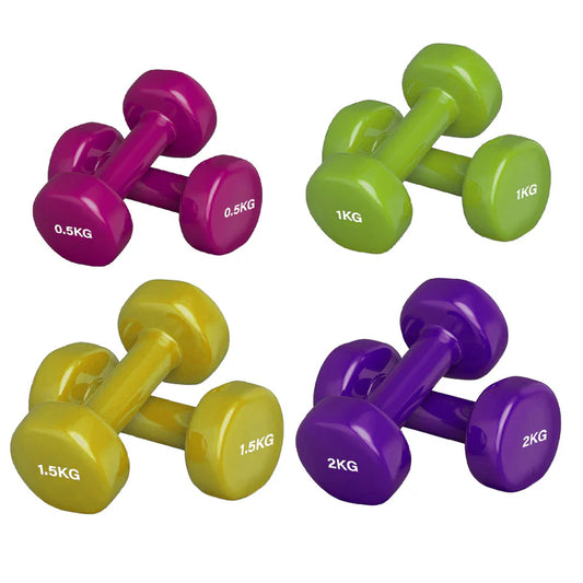 Set of colorful dumbbells with weight markings on a white background