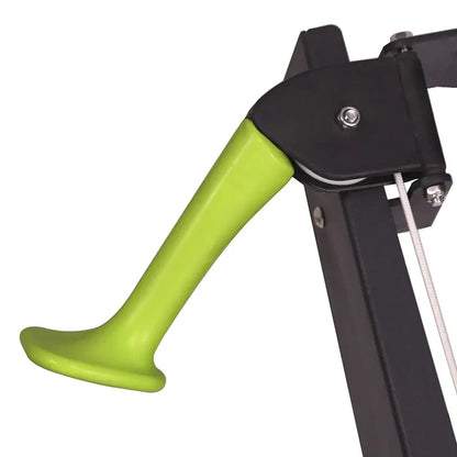 Green handle attached to a black metal structure on a white background