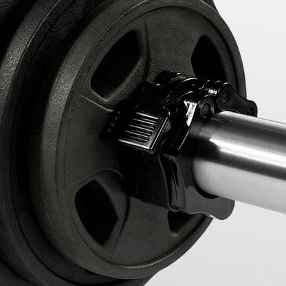 Close-up of a barbell with weight plates on a white background