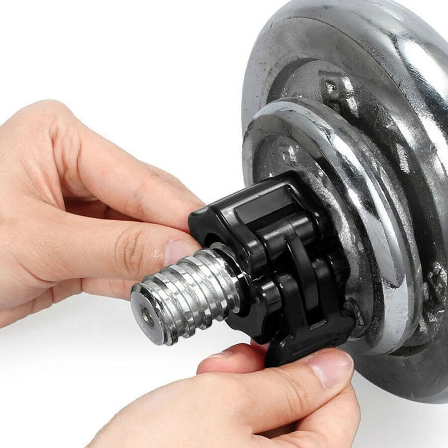 Person adjusting a black bike pedal onto a silver bicycle crank arm.