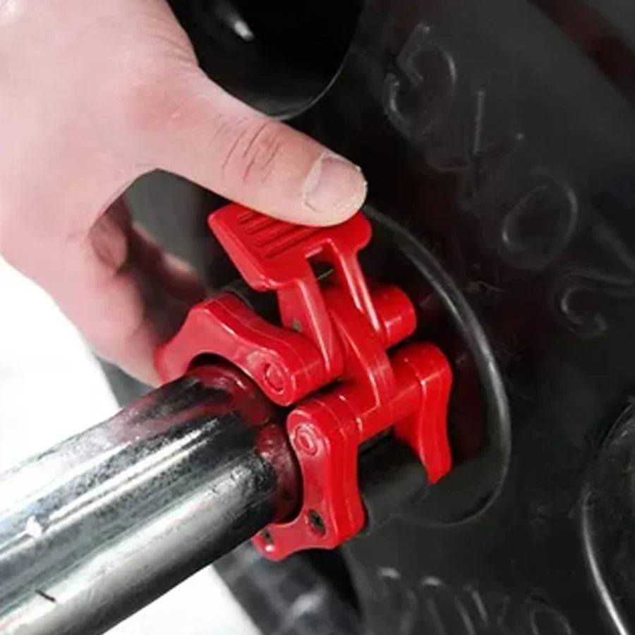 Red tool being used on a car tire valve stem cap.