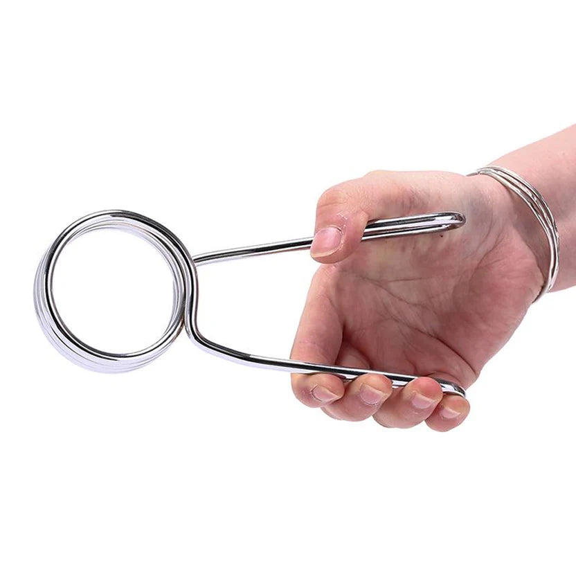 Metal spring clip on a white background