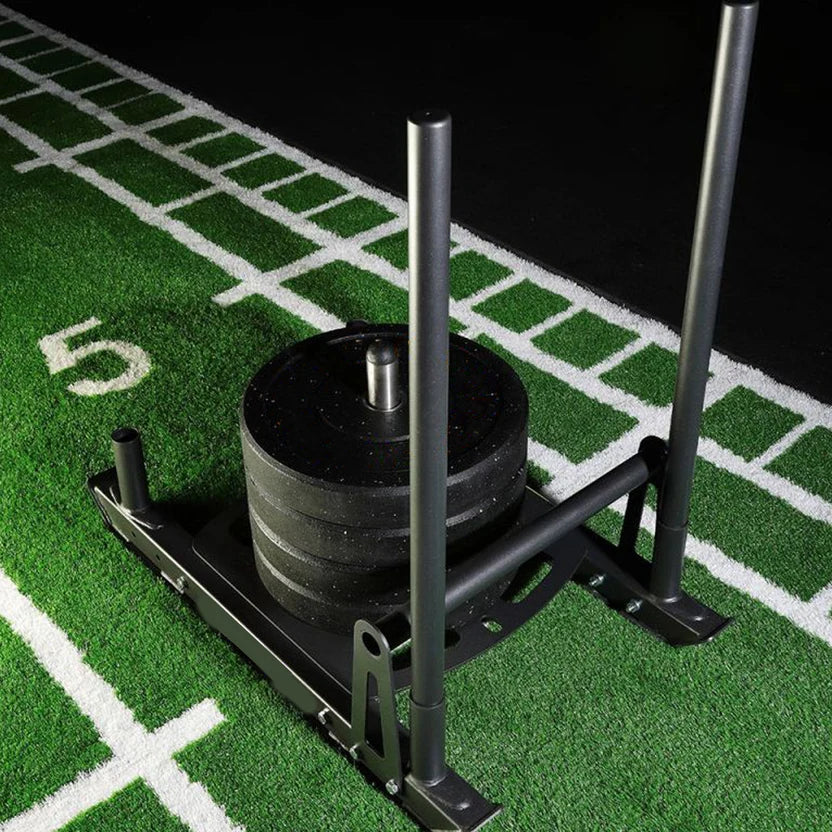 Weightlifting barbell with weight plates on a sports field