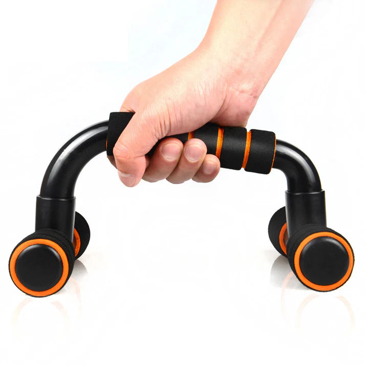 Hand holding a black and orange exercise handle against a white background