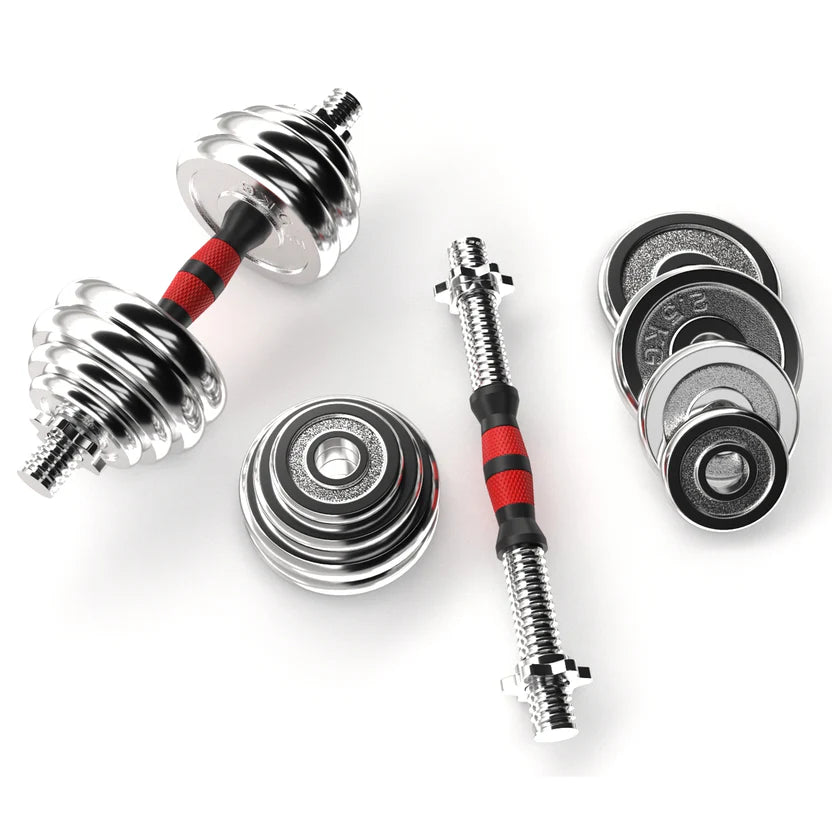 Set of adjustable dumbbells with weight plates on a white background
