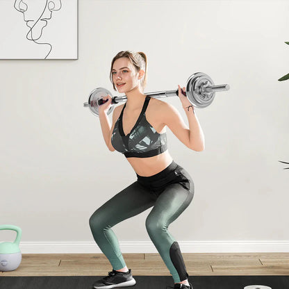 Set of adjustable dumbbells with weight plates on a white background