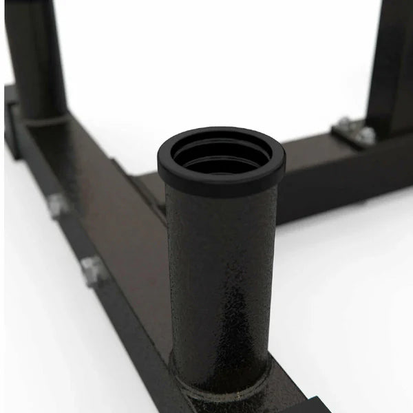 Black metal squat rack with chrome bar on a white background